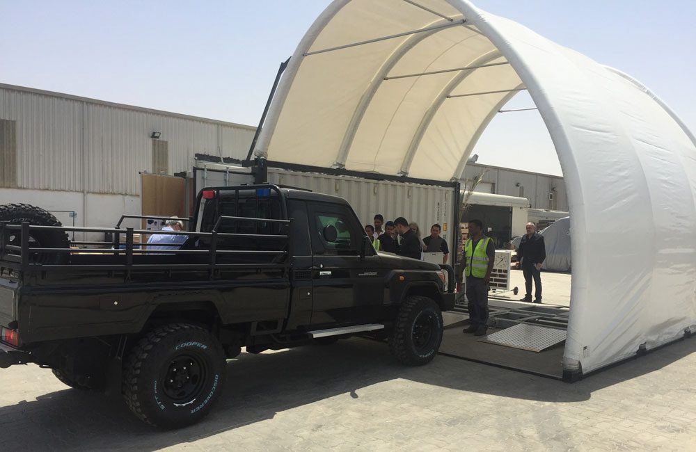 BM Inflatable pavilion attached to container with testing lane
