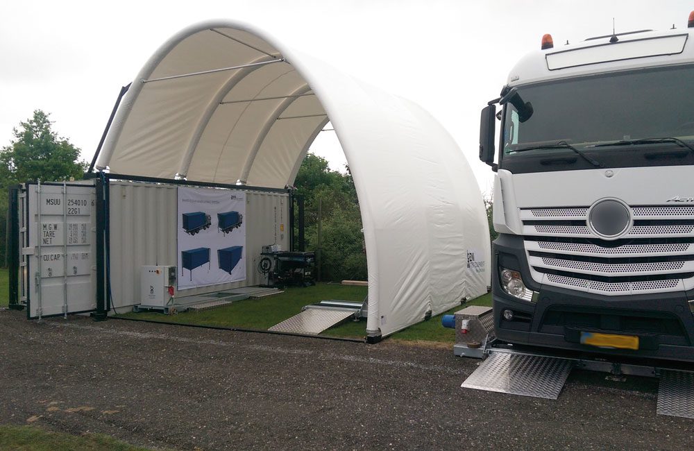 Inflatable pavilion on container with truck